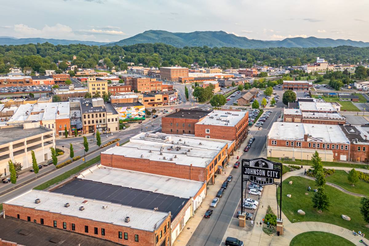 Downtown Johnson City TN businesses with mountain backdrop