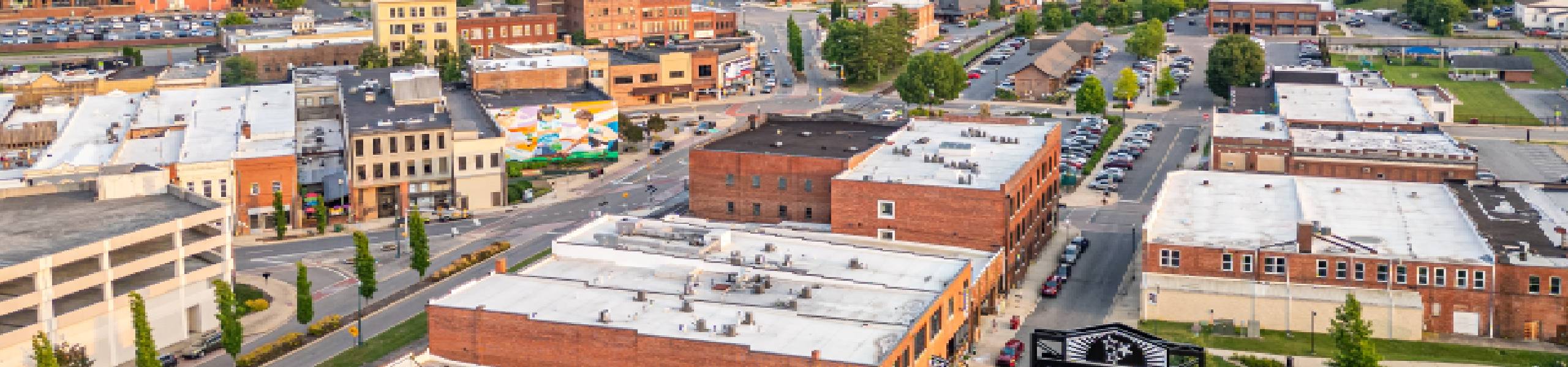A section of Johnson City, Tennessee, with several local businesses and a mountain in the background