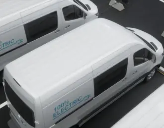 An image of four commercial vans with custom fleet wraps advertising an electric business